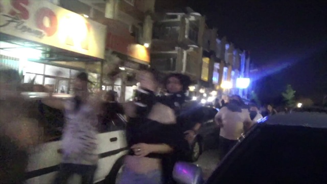 Video Reference: Event, Fun, Building, Crowd, City, Electric blue, Midnight, Luxury vehicle, Pedestrian, Night