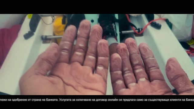 Video Reference: Finger, Gesture, Thumb, Font, Nail, Wrist, Flesh, Electric blue, Service, Wrinkle