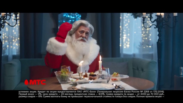 Video Reference: Beard, Table, Santa claus, Hat, Event, Candle, Facial hair, Holiday, Lap, Christmas decoration