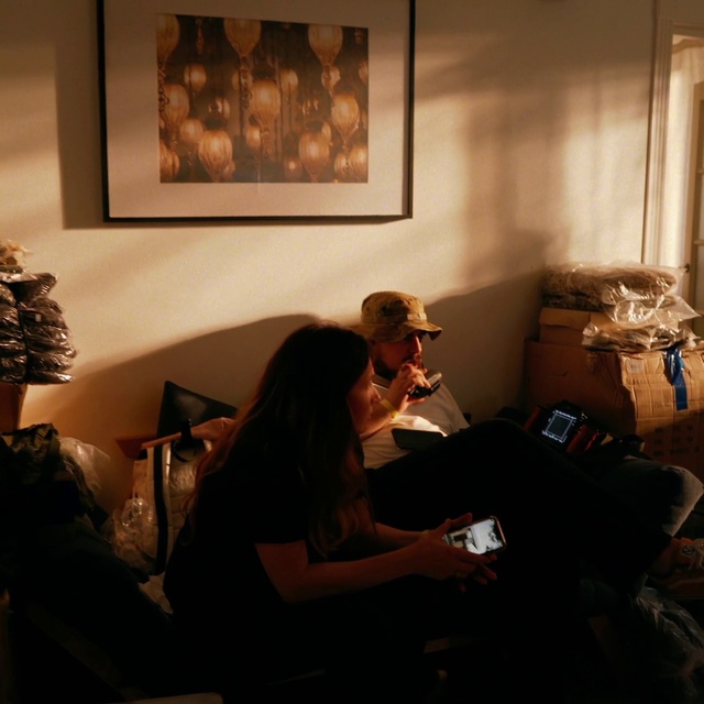 Video Reference: Picture frame, Comfort, Interior design, Living room, Art, Couch, Event, Flooring, Sitting, Conversation