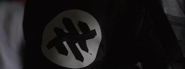 Video Reference: Gesture, Font, Symbol, Circle, Signage, Logo, Carmine, Emblem, Sign, Darkness