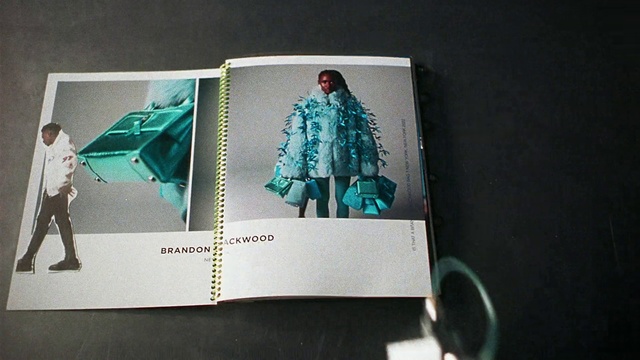 Video Reference: Human body, Sleeve, Publication, Collar, Material property, Font, Blazer, Tints and shades, Space, Pattern