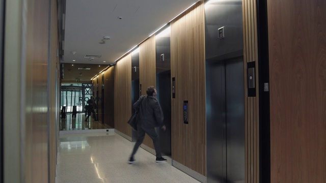Video Reference: Fixture, Flooring, Door, Glass, Building, City, Ceiling, Luggage and bags, Commercial building, Facade