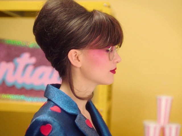 Video Reference: Forehead, Ear, Neck, Vision care, Jaw, Eyelash, Bun, Black hair, Eyewear, Earrings