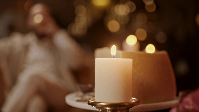 Video Reference: Candle, Wax, Lighting, Flame, Heat, Event, Fire, Interior design, Darkness, Decoration