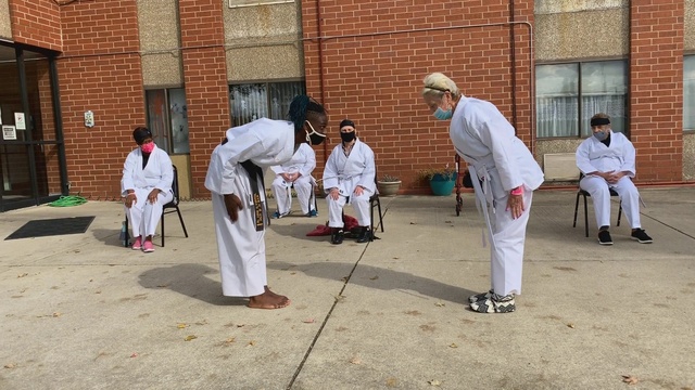 Video Reference: Temple, Window, Landscape, Chair, Musical instrument, Event, Uniform, Tradition, Competition event, Contact sport