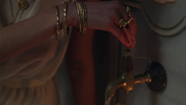 Video Reference: Dress, Sleeve, Sunglasses, Religious item, Wood, Body jewelry, Door, Formal wear, Wrist, Jewellery