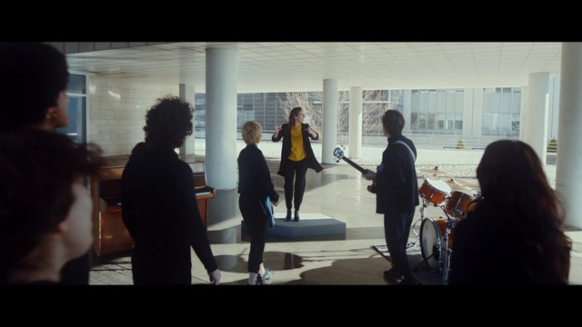 Video Reference: Standing, Art, Urban design, Automotive design, Font, Event, White-collar worker, City, Visual arts, Fun