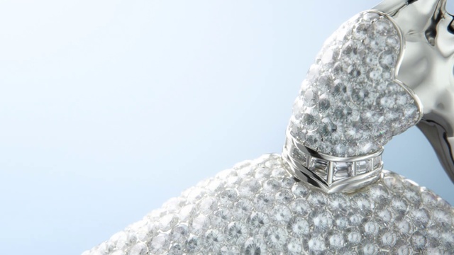 Video Reference: Outerwear, Sky, Headgear, Jewellery, Freezing, Sculpture, Metal, Fashion accessory, Art, Pattern