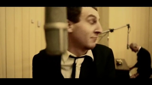 Video Reference: Chin, Eyebrow, Mouth, Jaw, Gesture, Microphone, Musician, Music, Eyewear, Formal wear