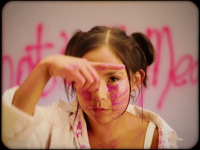 Video Reference: Cheek, Facial expression, Eyelash, Picture frame, Ear, Flash photography, Pink, Gesture, Vision care, Finger