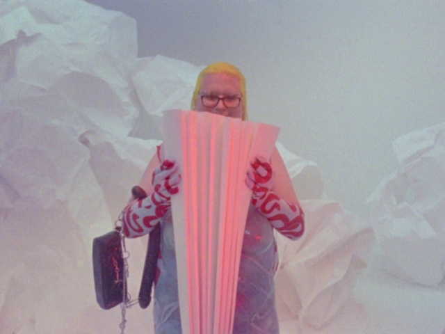 Video Reference: Sleeve, Pink, Art, Tints and shades, Magenta, Fashion design, Formal wear, Event, Visual arts, Eyewear