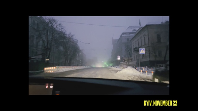 Video Reference: Automotive lighting, Sky, Automotive mirror, Asphalt, Mode of transport, Road surface, Atmospheric phenomenon, Rectangle, Building, Windscreen wiper