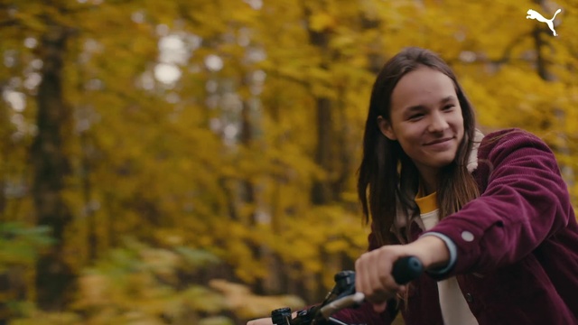 Video Reference: Face, Head, Smile, Bicycles--Equipment and supplies, Leaf, People in nature, Flash photography, Yellow, Bicycle handlebar, Sunlight