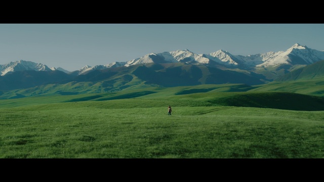 Video Reference: Sky, Mountain, Green, Natural landscape, People in nature, Slope, Terrain, Grassland, Grass, Mountain range
