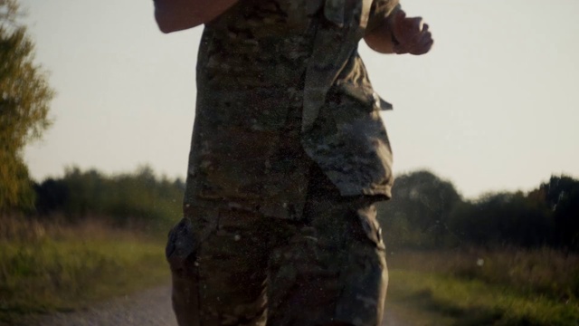 Video Reference: Sky, Plant, Military camouflage, Tree, Automotive tire, Gesture, Wood, Camouflage, Trunk, Grass