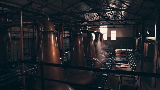 Video Reference: industrial, factory, distillery, copper, machinery, pipes, catwalk, interior, equipment, warehouse, production, engineering, metal, facility, steam, lighting