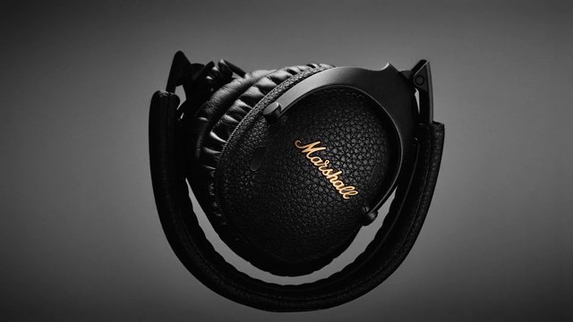 Video Reference: headphones, over-ear, black, audio, earcups, padded, wireless, product shot, close-up, gray background, technology, consumer electronics, music, headset