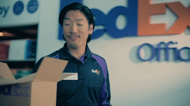 Video Reference: FedEx, office, employee, uniform, boxes, shipping, delivery, retail, indoor, packaging, logistics, service