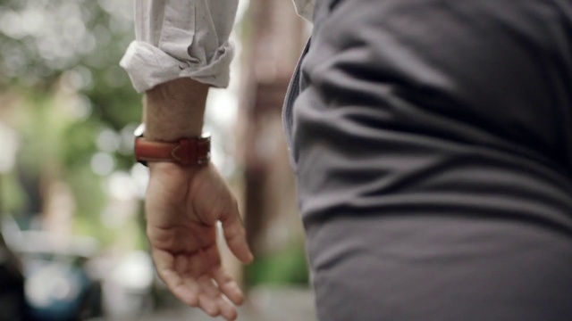 Video Reference: Sleeve, Gesture, Waist, Street fashion, Thumb, Holding hands, Elbow, Knee, T-shirt, Wrist