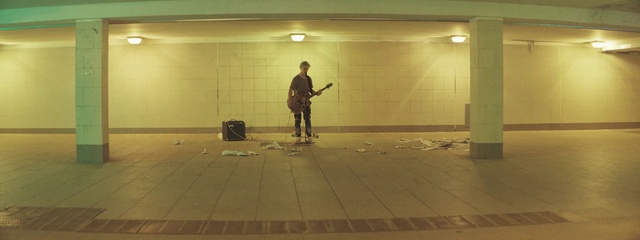 Video Reference: Musical instrument, Guitar, Lighting, Standing, Flooring, Floor, Wood, Drum, Door, Road surface