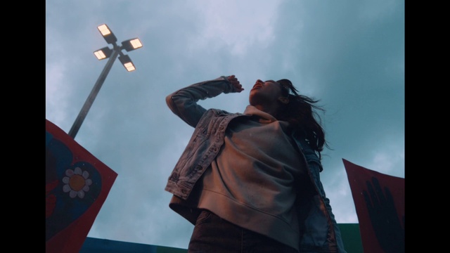 Video Reference: Sky, Cloud, Cross, Flag, Religious item, Symbol, Event, Audio equipment, Travel, Pole