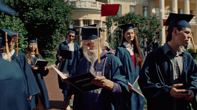 Video Reference: Outerwear, Smile, Mortarboard, Scholar, Hat, Academic dress, Gesture, Graduation, Headgear, Academic institution