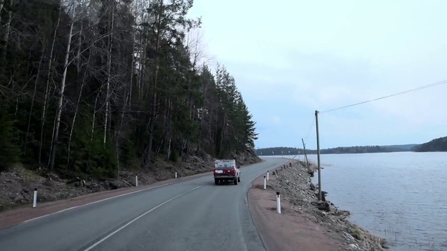 Video Reference: Tire, Water, Sky, Vehicle, Car, Plant, Road surface, Wheel, Asphalt, Tree