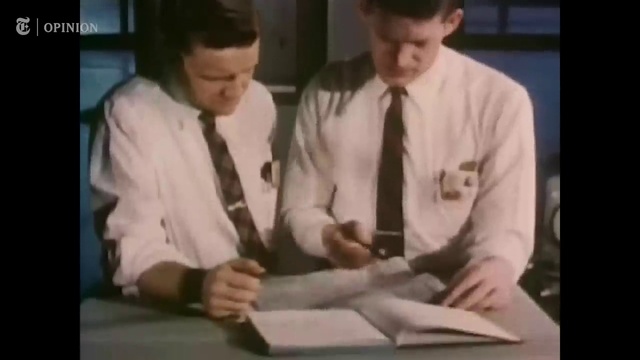 Video Reference: Gesture, Sharing, Tie, Font, Event, Formal wear, Hat, White-collar worker, Desk, Display device