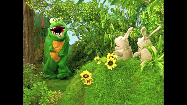 Video Reference: Plant, People in nature, Organism, Terrestrial plant, Grass, Toy, Natural landscape, Happy, Lawn ornament, Groundcover