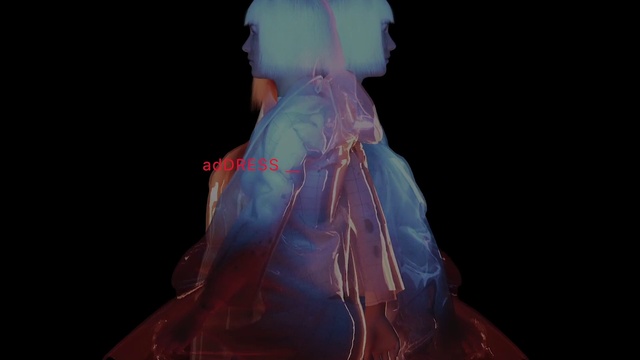 Video Reference: Outerwear, Hairstyle, Shoulder, Sleeve, Fashion design, Entertainment, Flash photography, Event, Costume design, Performing arts