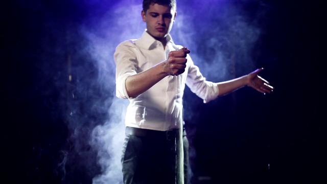Video Reference: Hand, Arm, Flash photography, Microphone, Purple, Entertainment, Gesture, Music artist, Performing arts, Artist