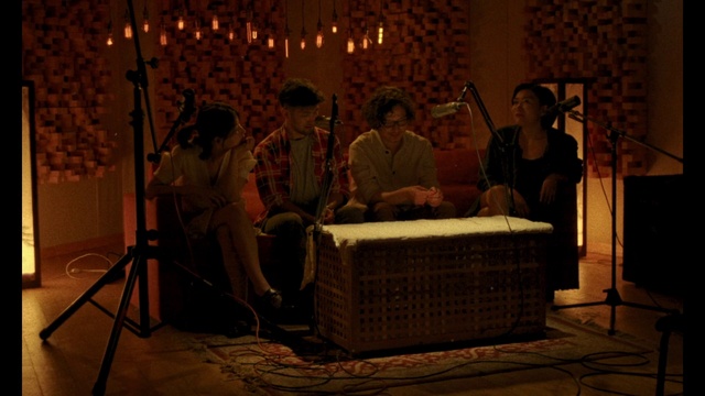 Video Reference: Candle, Microphone, Music, Musician, Public address system, Event, Musical instrument, Entertainment, Chair, Folk instrument