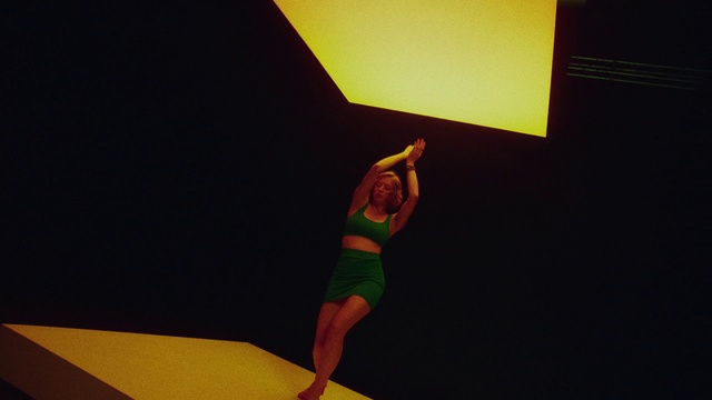 Video Reference: Yellow, Knee, Thigh, Entertainment, Art, Performing arts, Sportswear, Human leg, Balance, Event