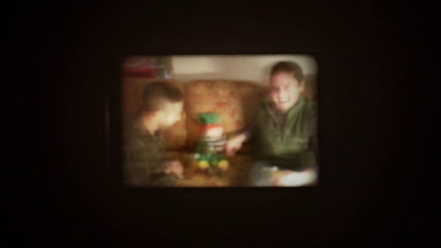 Video Reference: Art, Font, Display device, Event, Darkness, Fun, Visual arts, Room, Facial hair, Circle