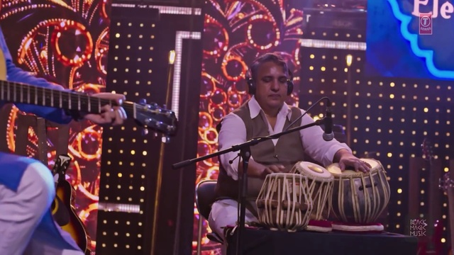 Video Reference: Microphone, Membranophone, Musician, Musical instrument, Idiophone, String instrument, Purple, Guitar accessory, Music artist, String instrument