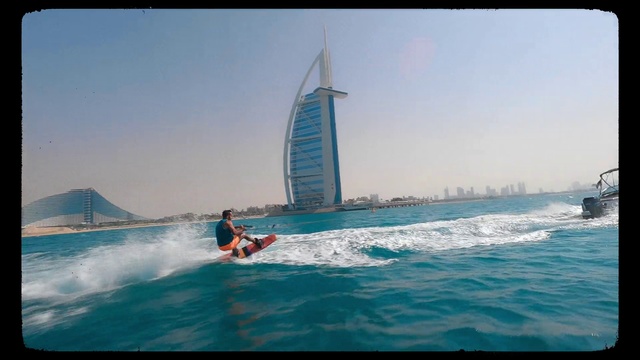Video Reference: Water, Sky, Surfing, Watercraft, Boat, Sailing, Outdoor recreation, Tower, Skyscraper, Vehicle