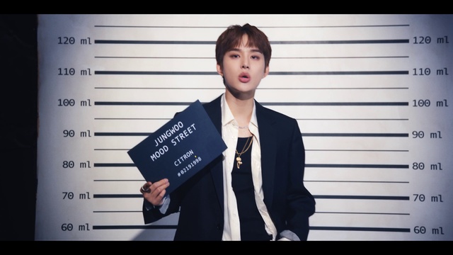 Video Reference: Flash photography, Sleeve, Gesture, Font, Collar, Blazer, Dress shirt, Electric blue, Formal wear, White-collar worker