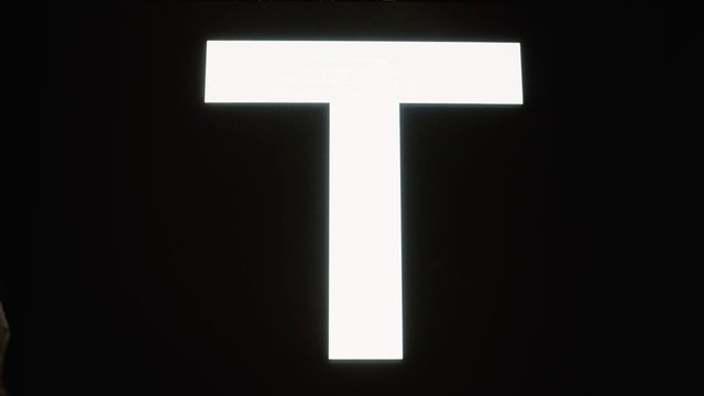 Video Reference: letter T, alphabet, typography, white, black background, minimal, graphic, symbol, text
