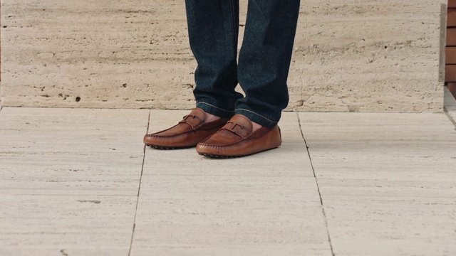 Video Reference: Footwear, Trousers, Shoe, Leg, Street fashion, Road surface, Wood, Thigh, Flooring, Grey