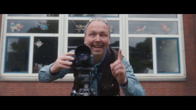 Video Reference: Photographer, Window, Camera lens, Reflex camera, Digital camera, Flash photography, Smile, Camera, Camera accessory, Lens