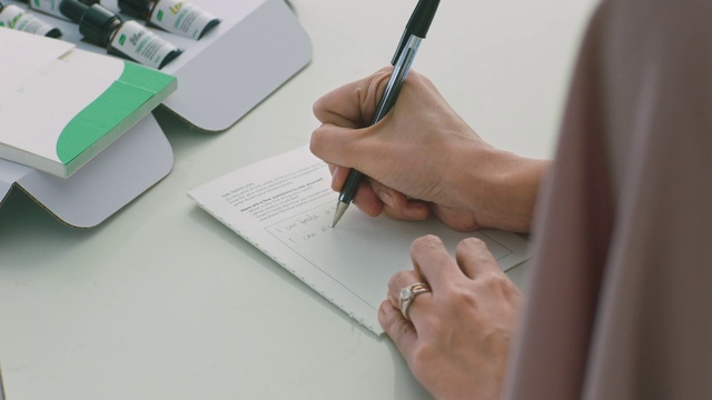 Video Reference: Hand, Table, Office supplies, Gesture, Nail, Finger, Writing implement, Handwriting, Pen, Writing instrument accessory