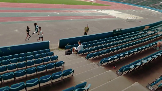 Video Reference: Chair, Line, Red, Leisure, Sport venue, Event, Fan, Stadium, Arena, Sports