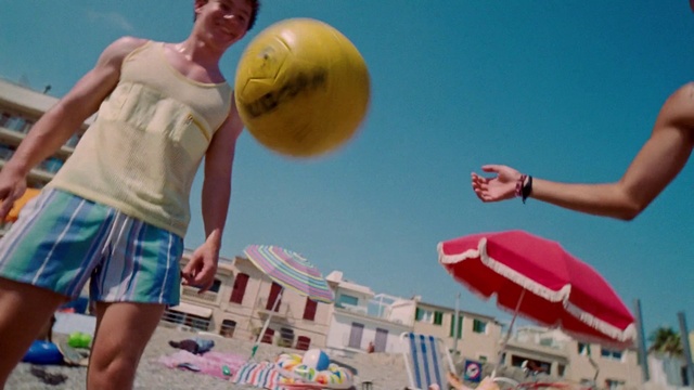 Video Reference: Sky, Playing sports, Daytime, Photograph, Sports equipment, White, Shorts, Light, People on beach, People in nature