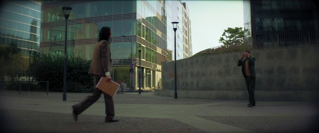 Video Reference: Footwear, Building, Standing, Street fashion, Gesture, Road surface, Grey, Waist, Thigh, Knee