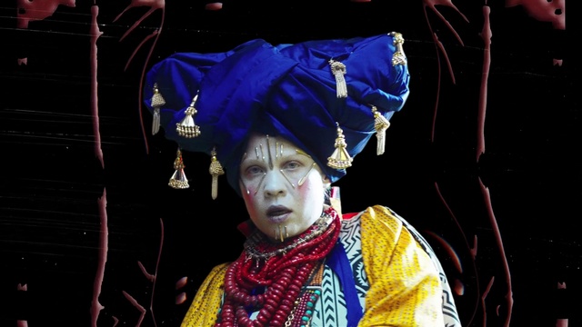 Video Reference: Purple, Entertainment, Headgear, Performing arts, Sleeve, Event, Electric blue, Tradition, Fashion design, Costume