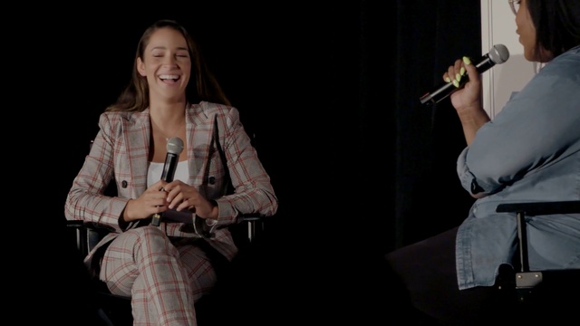 Video Reference: Microphone, Smile, Entertainment, Tartan, Performing arts, Event, Microphone stand, Spokesperson, Jewellery, Audio equipment