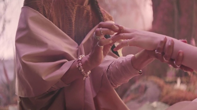 Video Reference: Hand, Purple, Dress, Neck, Sleeve, Gesture, Finger, Pink, Violet, Silk