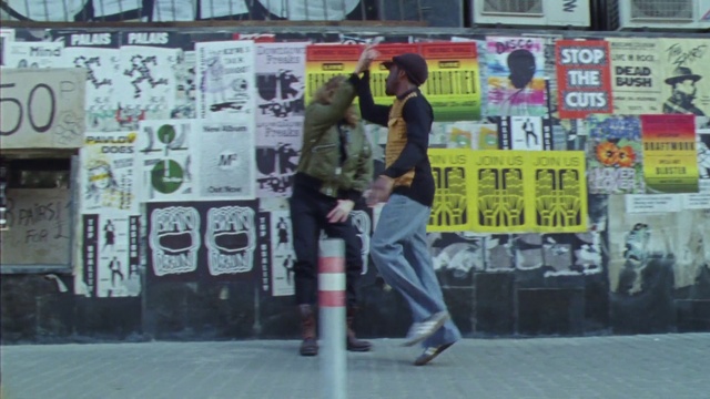 Video Reference: Font, Street fashion, Art, Window, Road, Luggage and bags, Graffiti, Advertising, Facade, Street