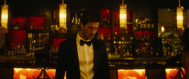 Video Reference: Bow tie, Orange, Dress shirt, Collar, Beard, Blazer, Formal wear, Suit, Facial hair, Event